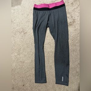 Women’s full length grey Redbox workout leggings with pink & black around top.